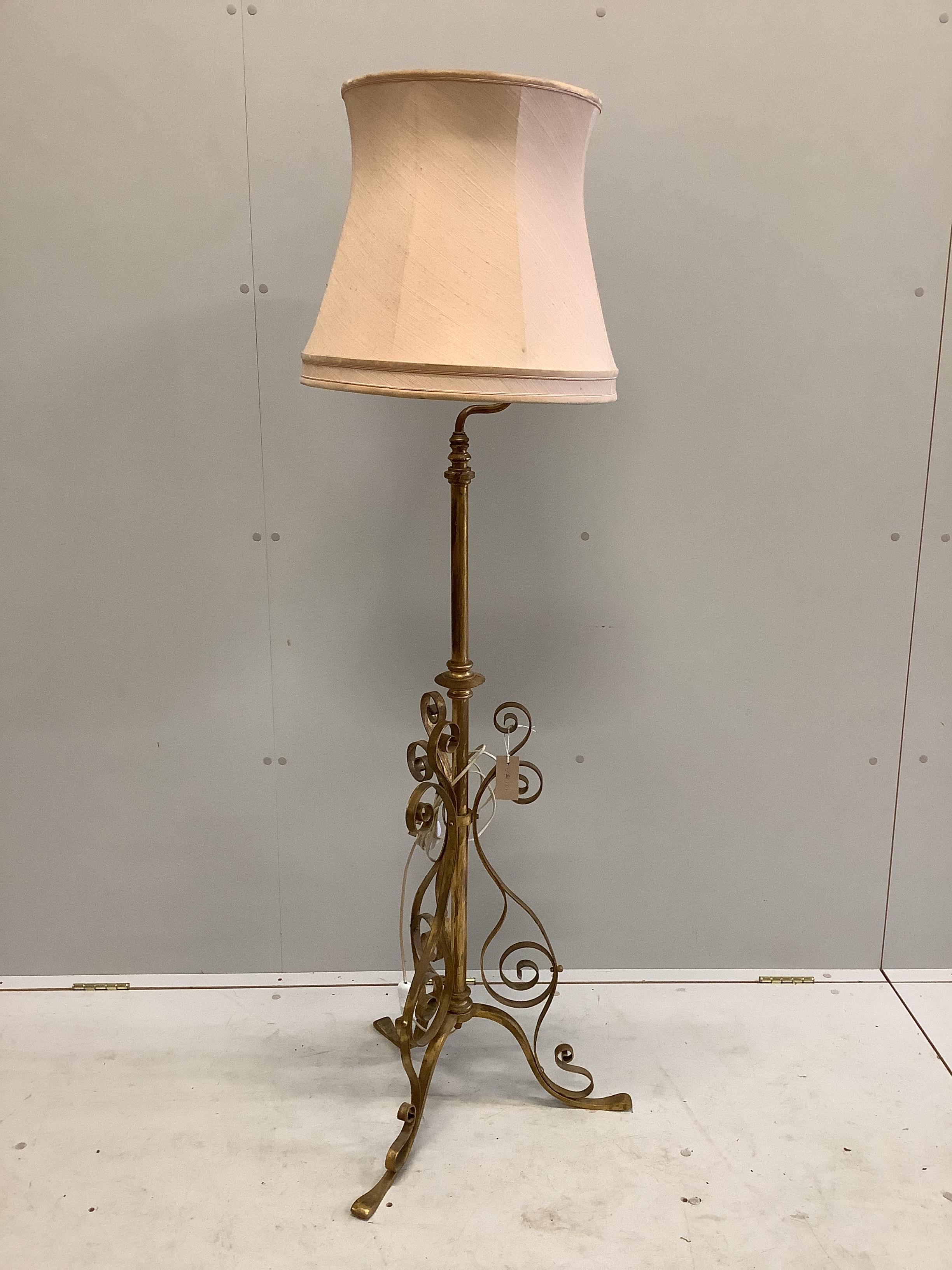 An early 20th century painted wrought iron telescopic standard lamp.